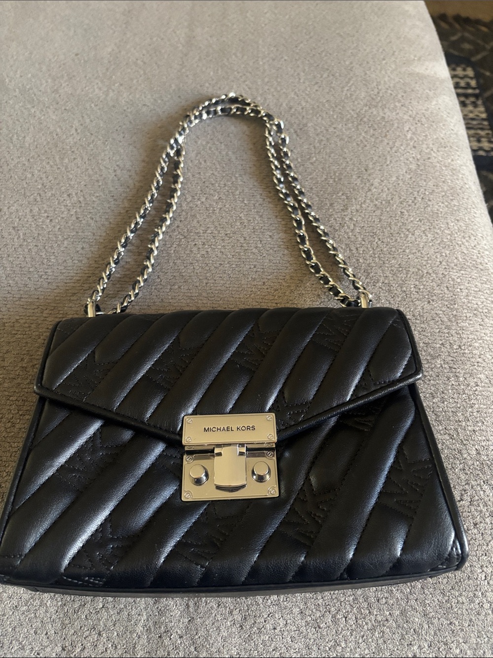 Michael Kors Black Quilted Leather Crossbody with Silver Chain.